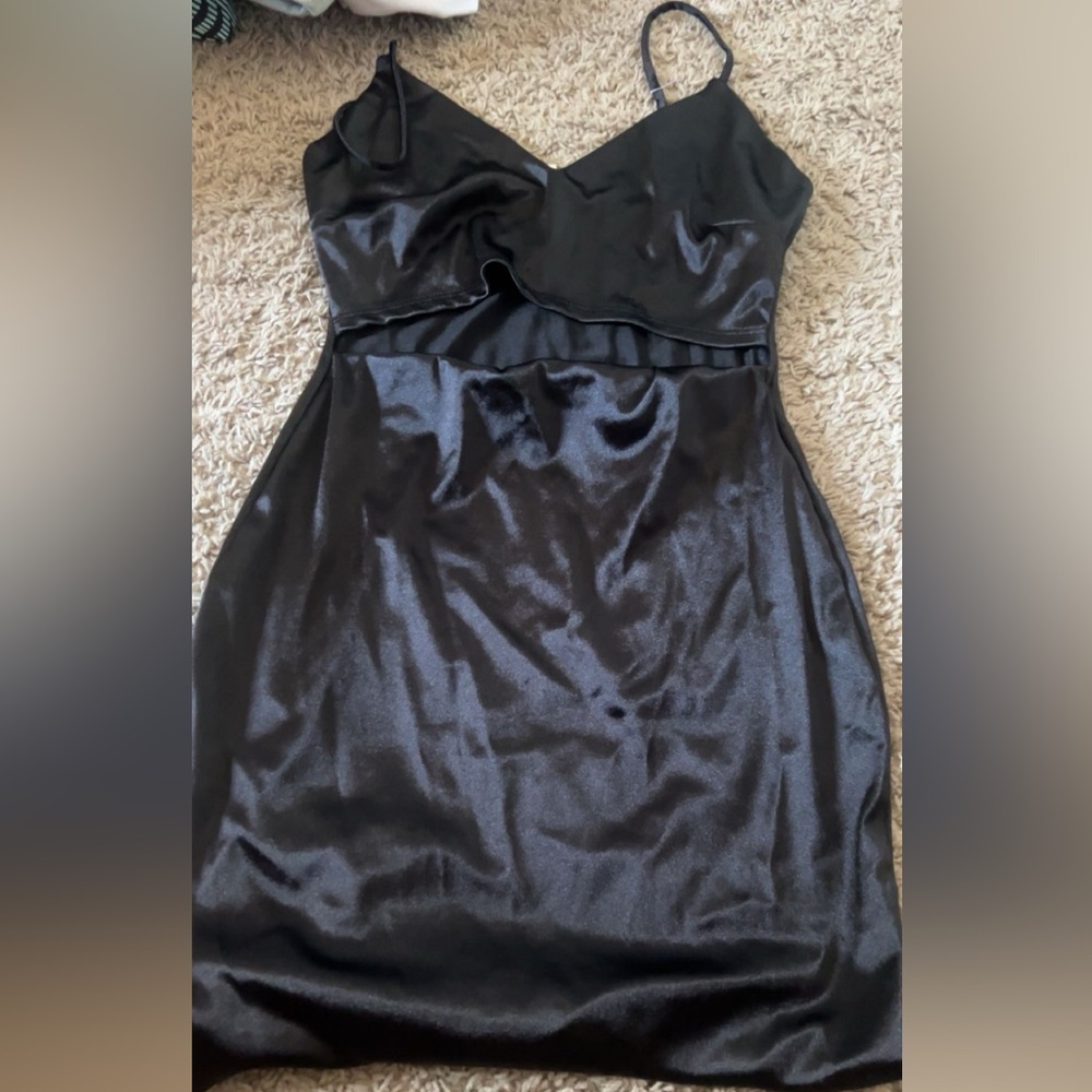 Tight black dress with slit in middle